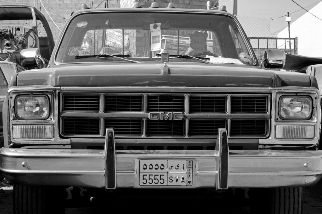 Grayscale Photo of Vintage Car